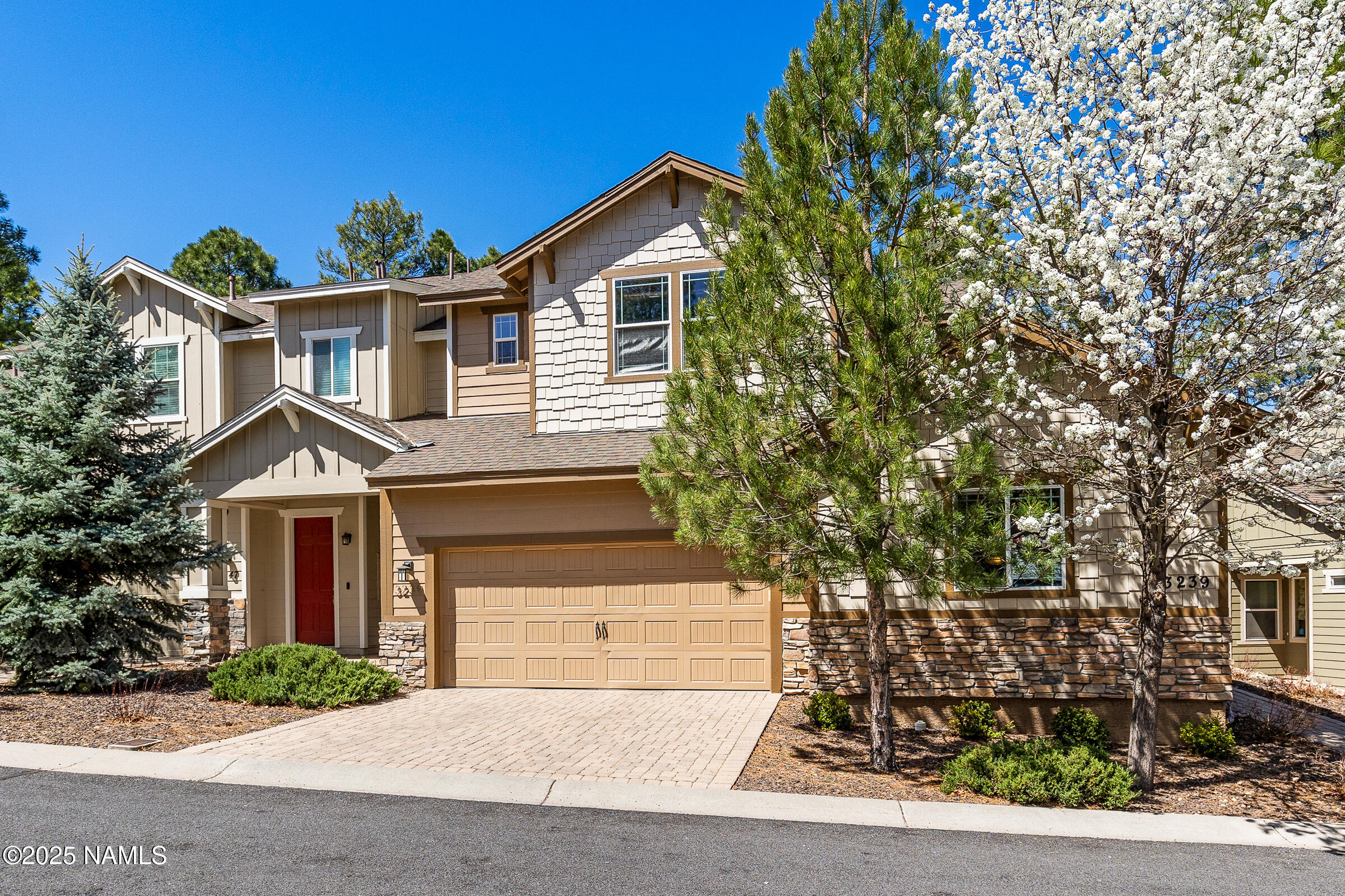 front view of a house with a yard