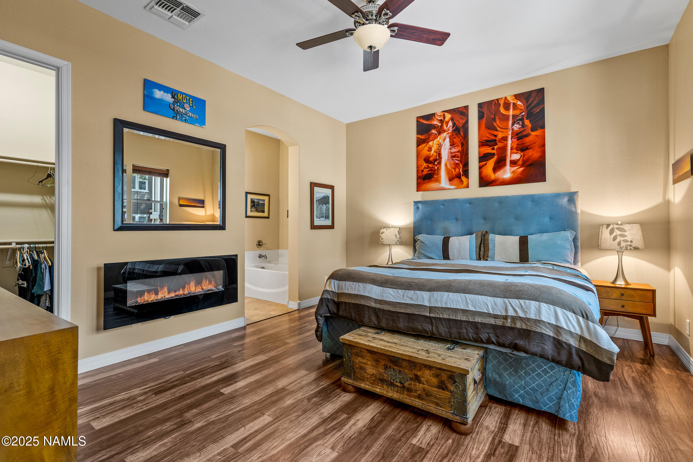 3239 Merryvale Lane Flagstaff, AZ 86005 - Photo 14 of 40 a bedroom with a bed and a fireplace