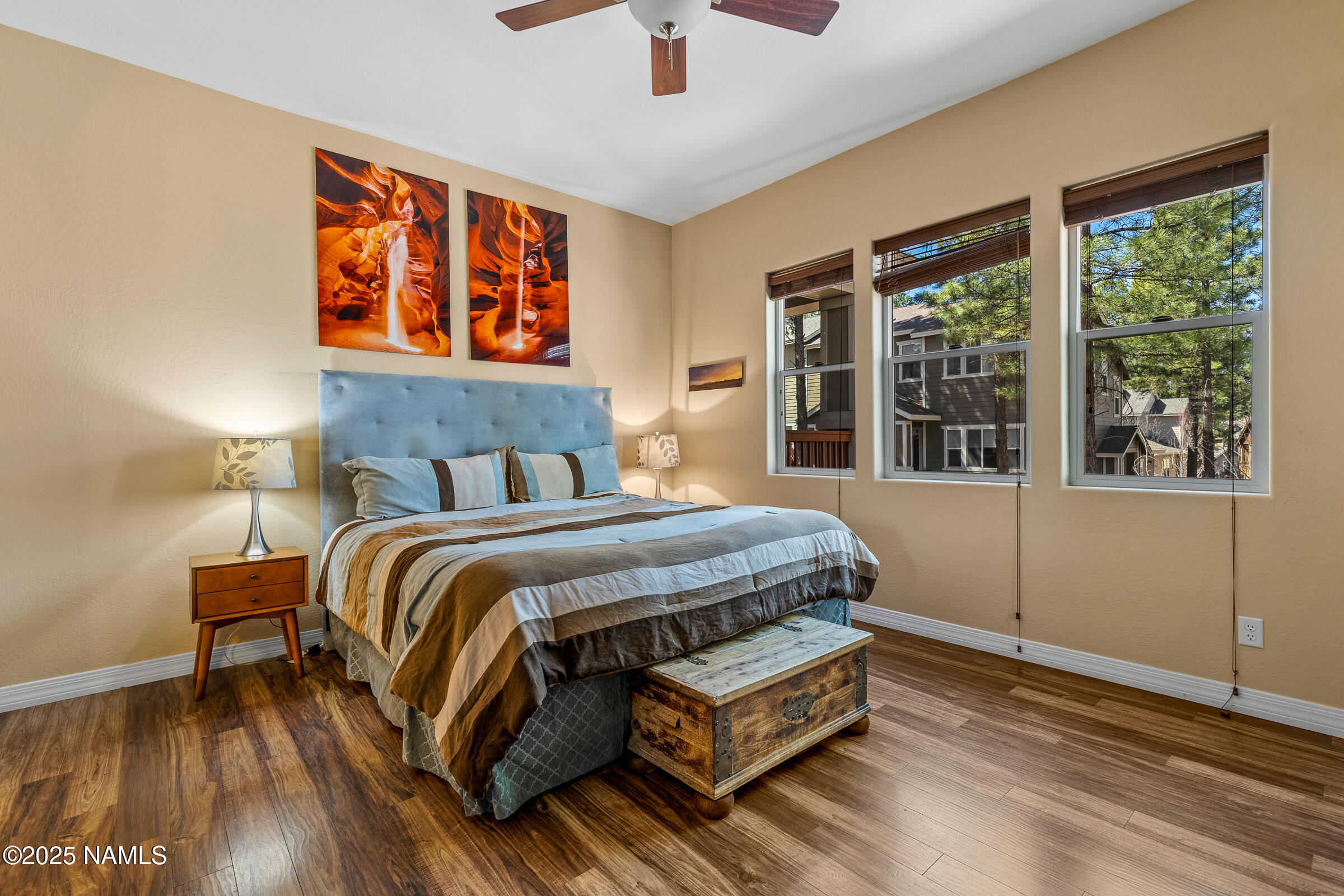 3239 Merryvale Lane Flagstaff, AZ 86005 - Photo 15 of 40 a bedroom with a bed and wooden floor