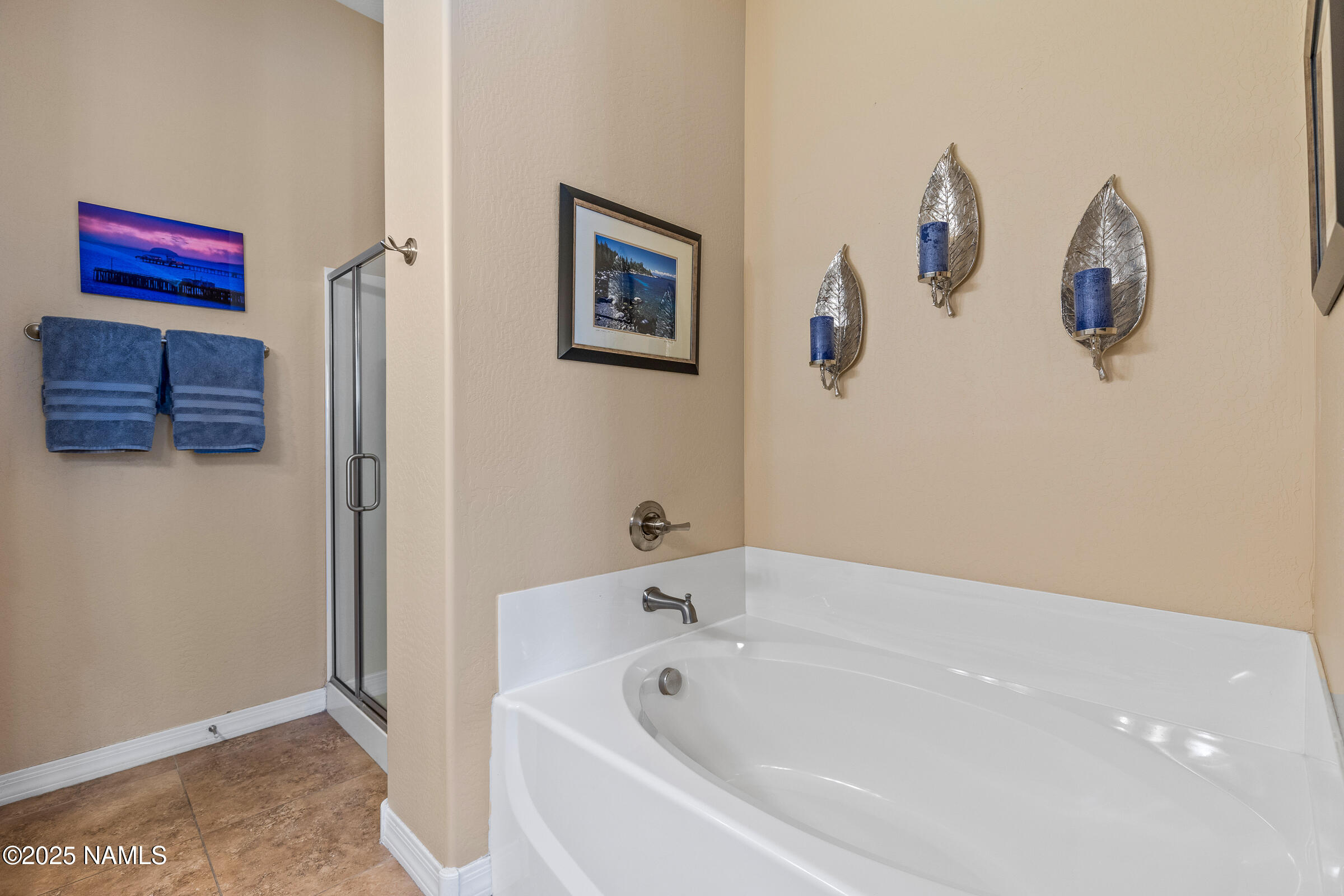 3239 Merryvale Lane Flagstaff, AZ 86005 - Photo 18 of 40 a bathroom with a bathtub and a shower