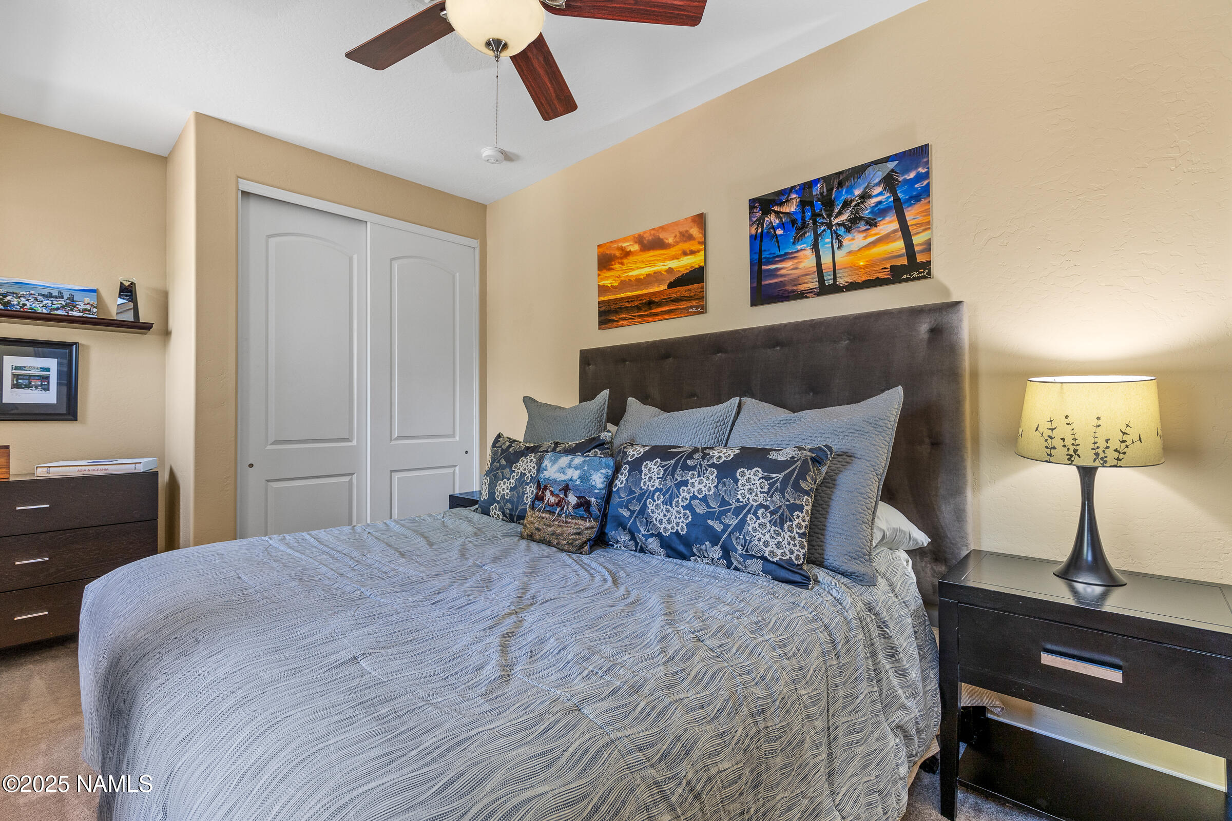 3239 Merryvale Lane Flagstaff, AZ 86005 - Photo 21 of 40 a bedroom with bed and a chandelier