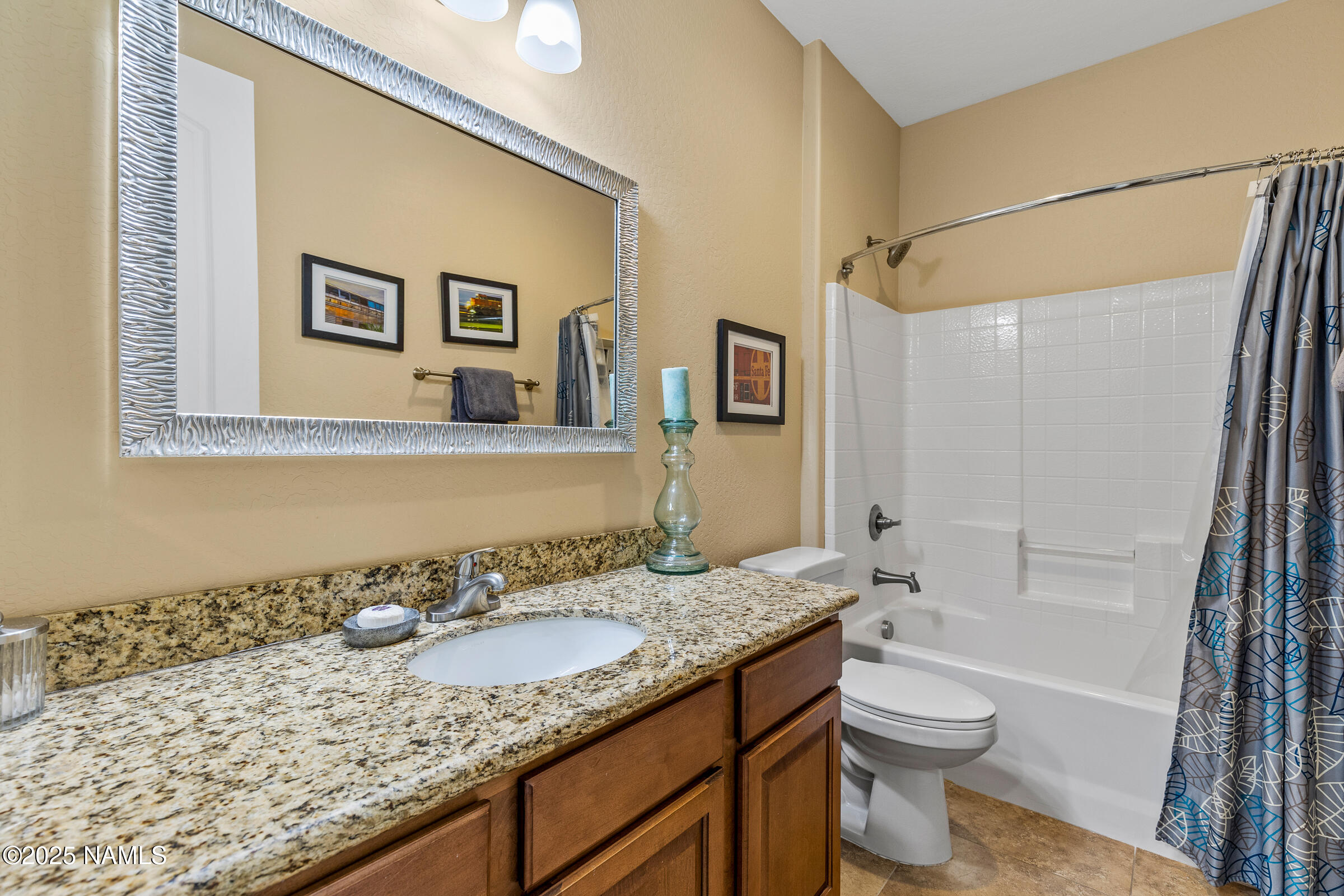 3239 Merryvale Lane Flagstaff, AZ 86005 - Photo 25 of 40 a bathroom with a granite countertop sink toilet and shower
