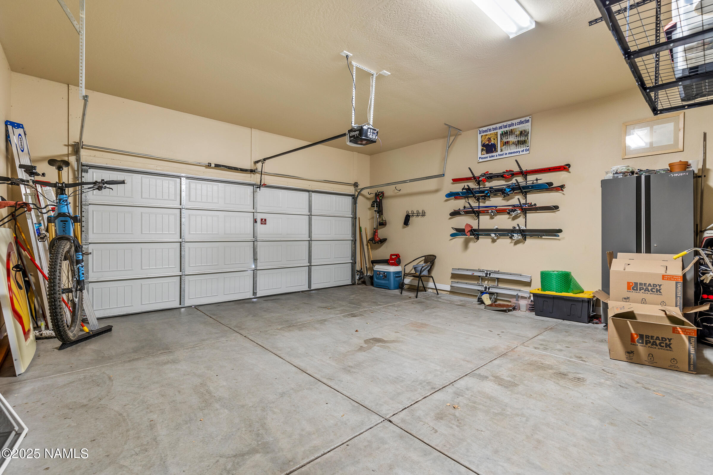 3239 Merryvale Lane Flagstaff, AZ 86005 - Photo 29 of 40 a view of a garage with rack and bicycle
