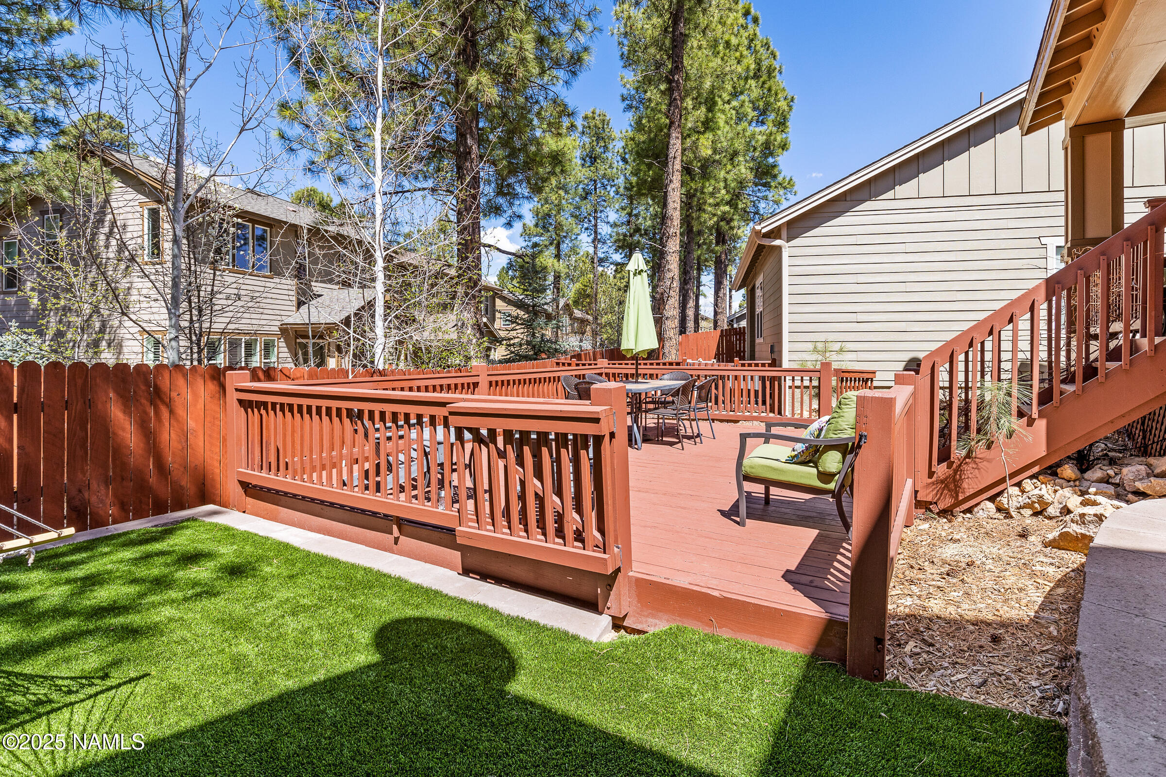 3239 Merryvale Lane Flagstaff, AZ 86005 - Photo 31 of 40 a view of a bench in the backyard