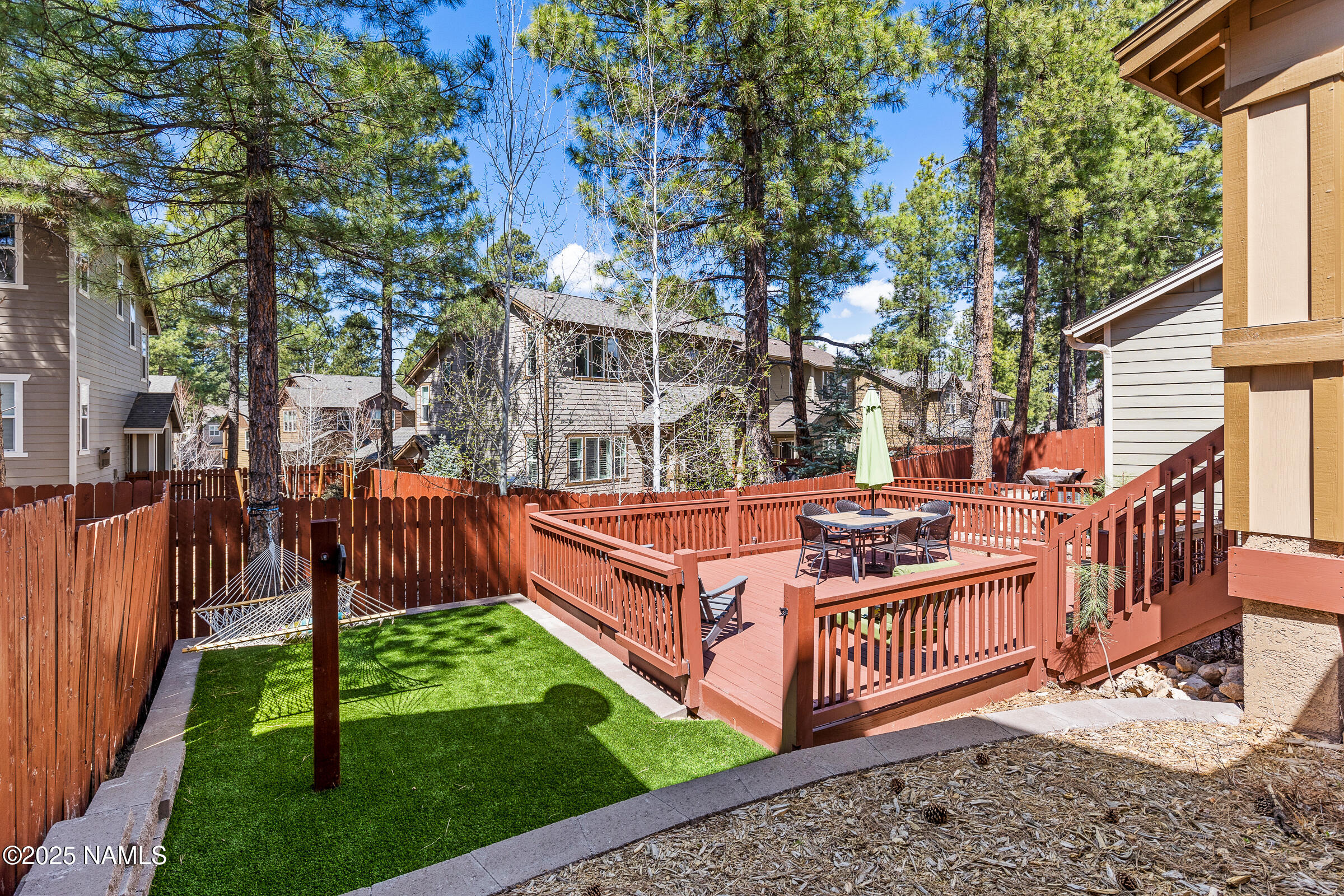 3239 Merryvale Lane Flagstaff, AZ 86005 - Photo 32 of 40 a view of a chairs in the backyard
