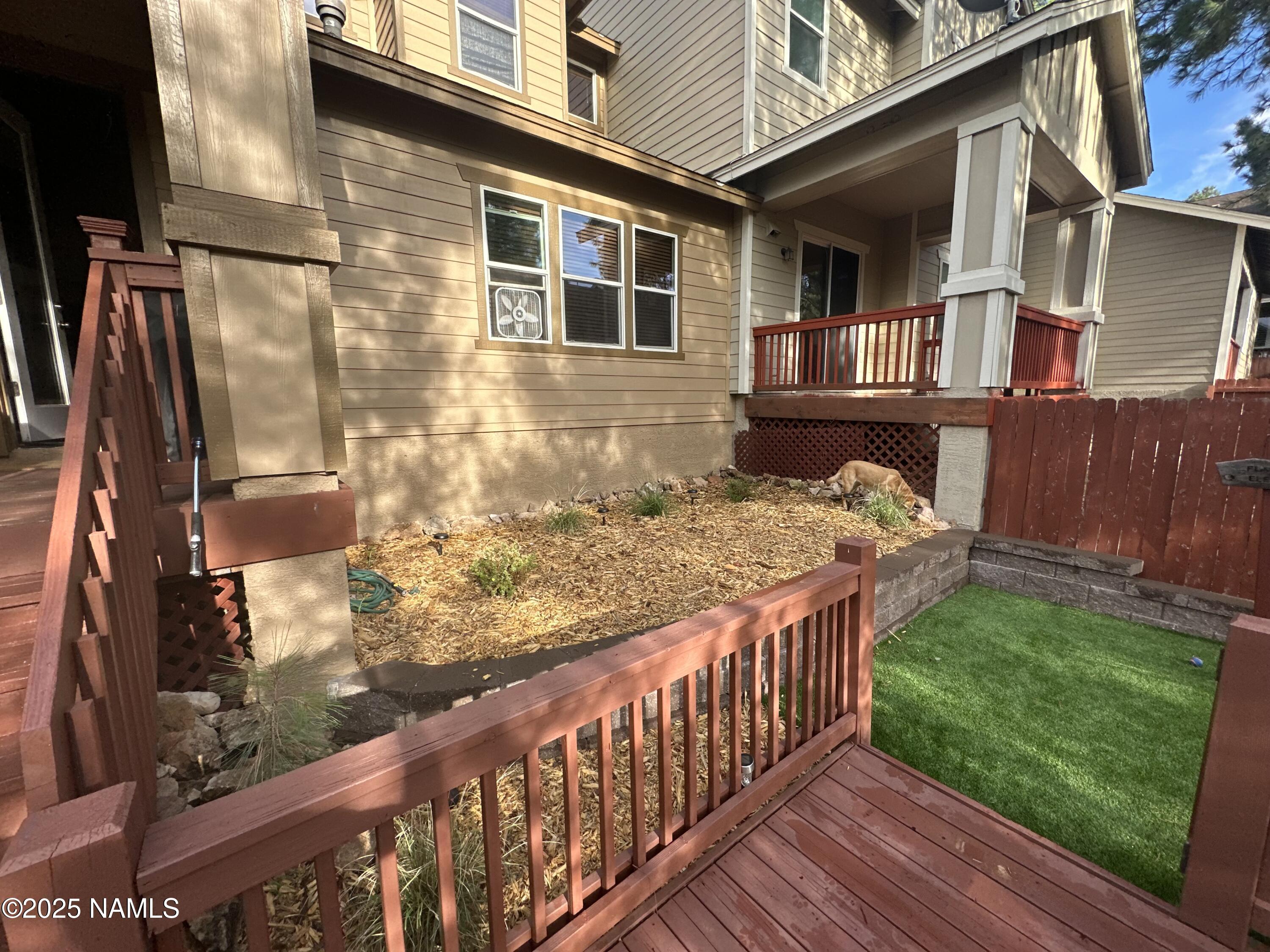 3239 Merryvale Lane Flagstaff, AZ 86005 - Photo 37 of 40 a view of a house with a wooden fence