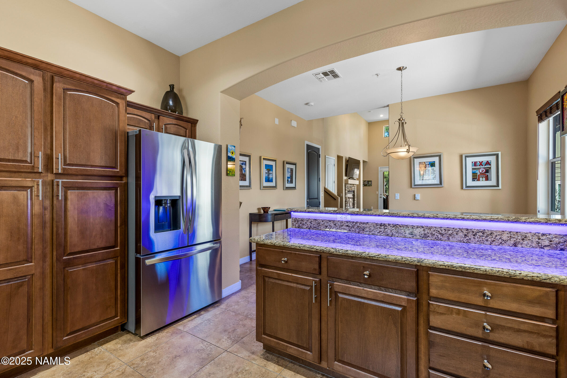 3239 Merryvale Lane Flagstaff, AZ 86005 - Photo 6 of 40 a kitchen with stainless steel appliances granite countertop a refrigerator and a sink