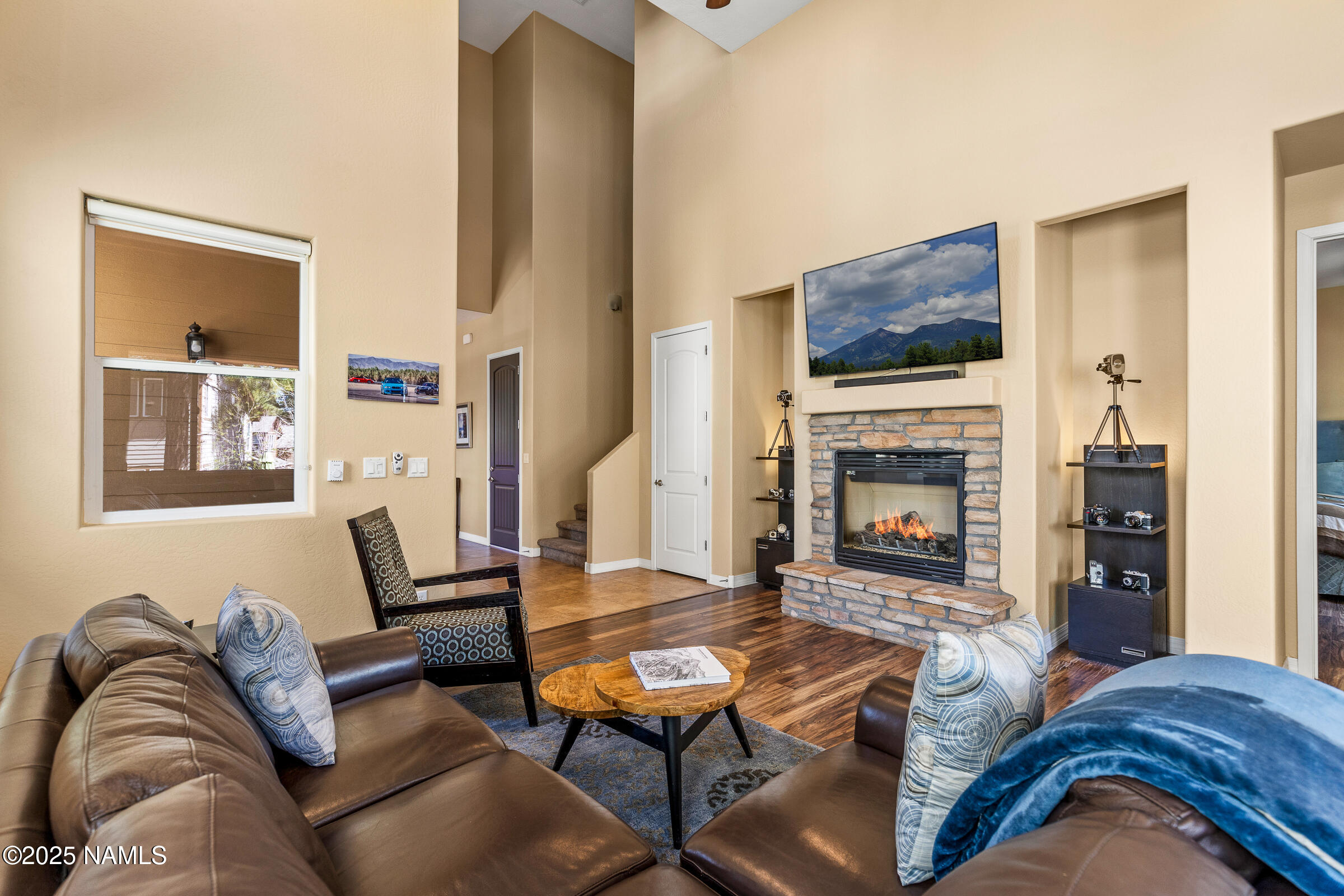 3239 Merryvale Lane Flagstaff, AZ 86005 - Photo 7 of 40 a living room with furniture and a fireplace