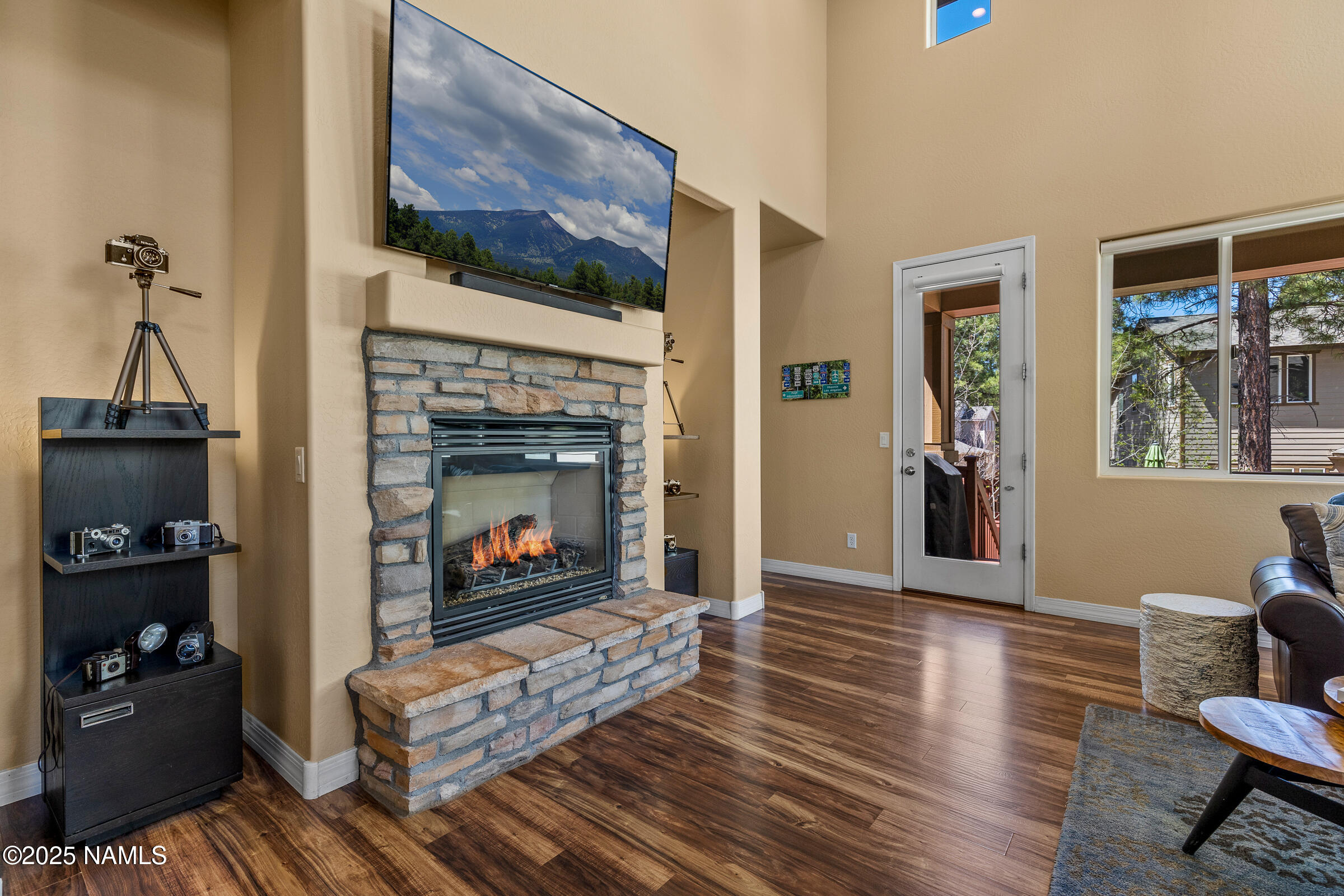 3239 Merryvale Lane Flagstaff, AZ 86005 - Photo 9 of 40 a living room with furniture and a fireplace