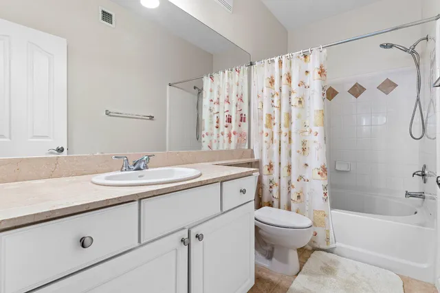 a bathroom with a sink toilet a shower and a mirror