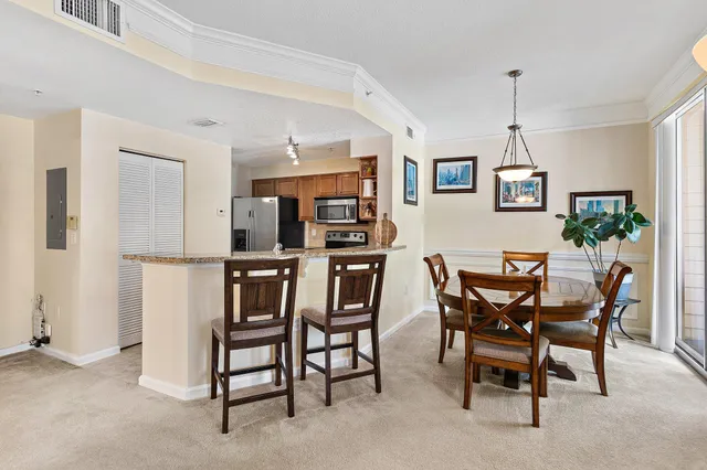 a dining room with furniture and window