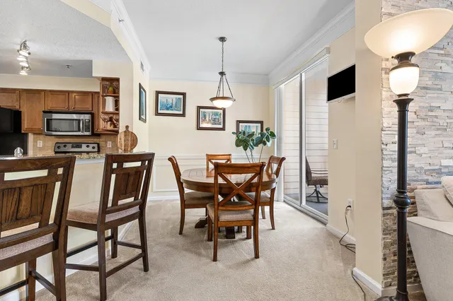 a dining room with furniture and window