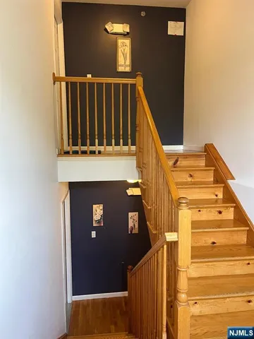 a view of stairs with wooden floor