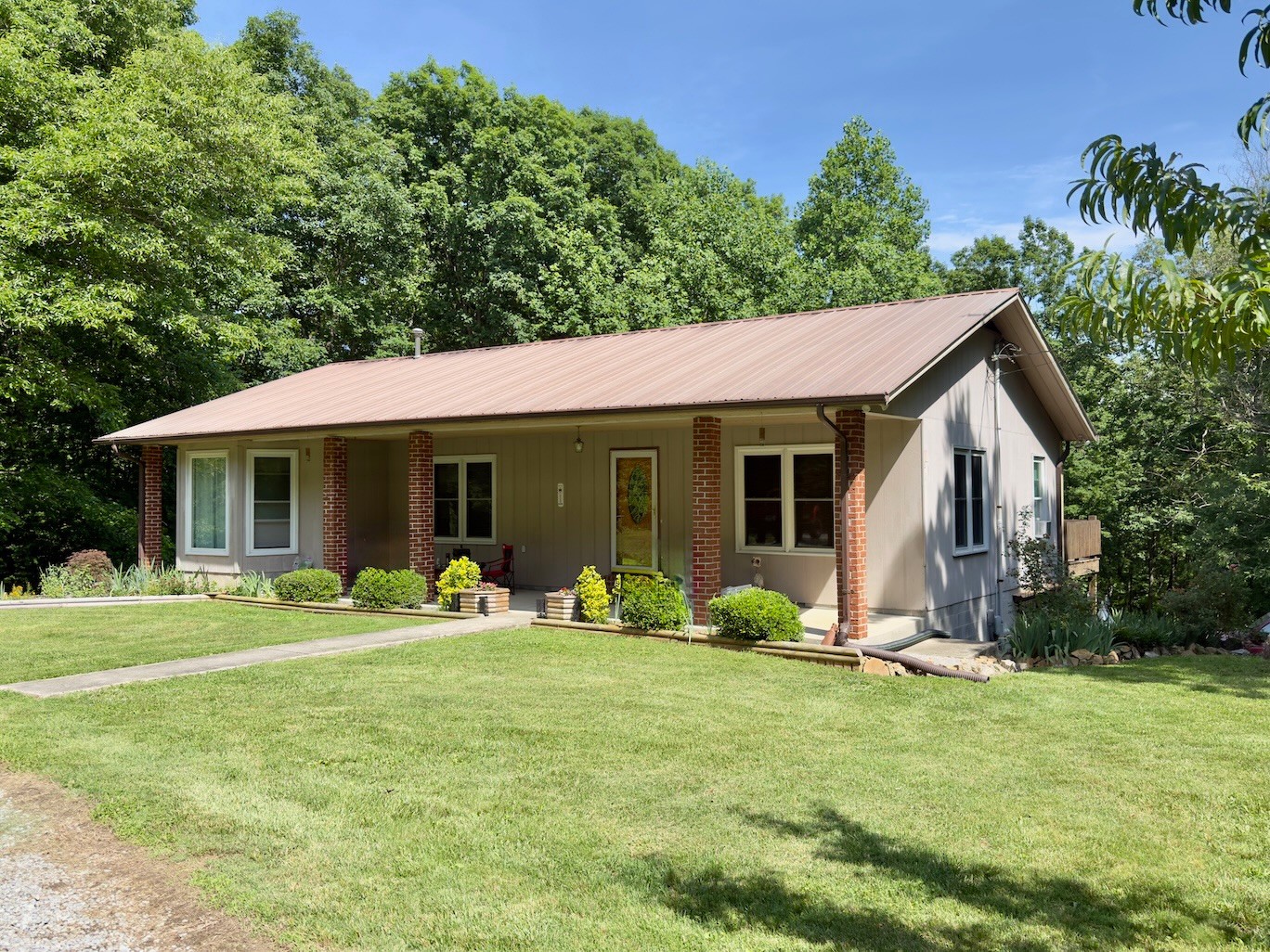 3080 Pleasant Ridge Road Woodbury, TN 37190 - Photo 1 of 19 a front view of house with yard and seating area