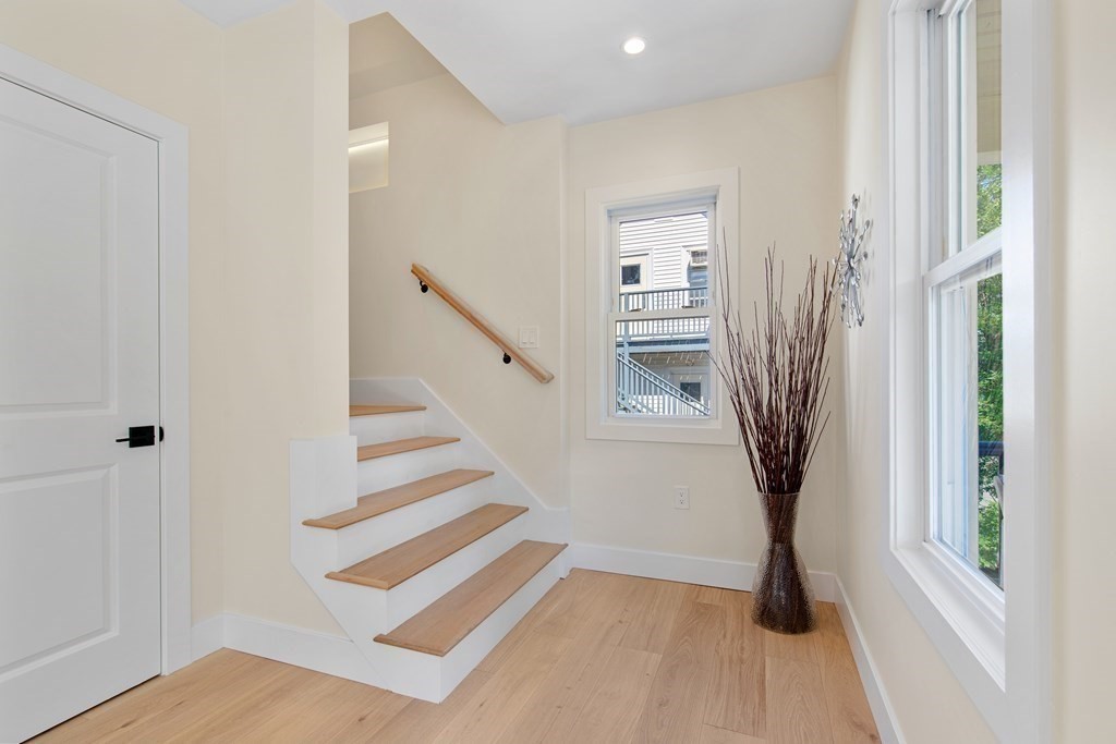 50 Whitfield Road, Unit 50 Somerville, MA 02144 - Photo 19 of 38 a view of entryway with furniture and wooden floor