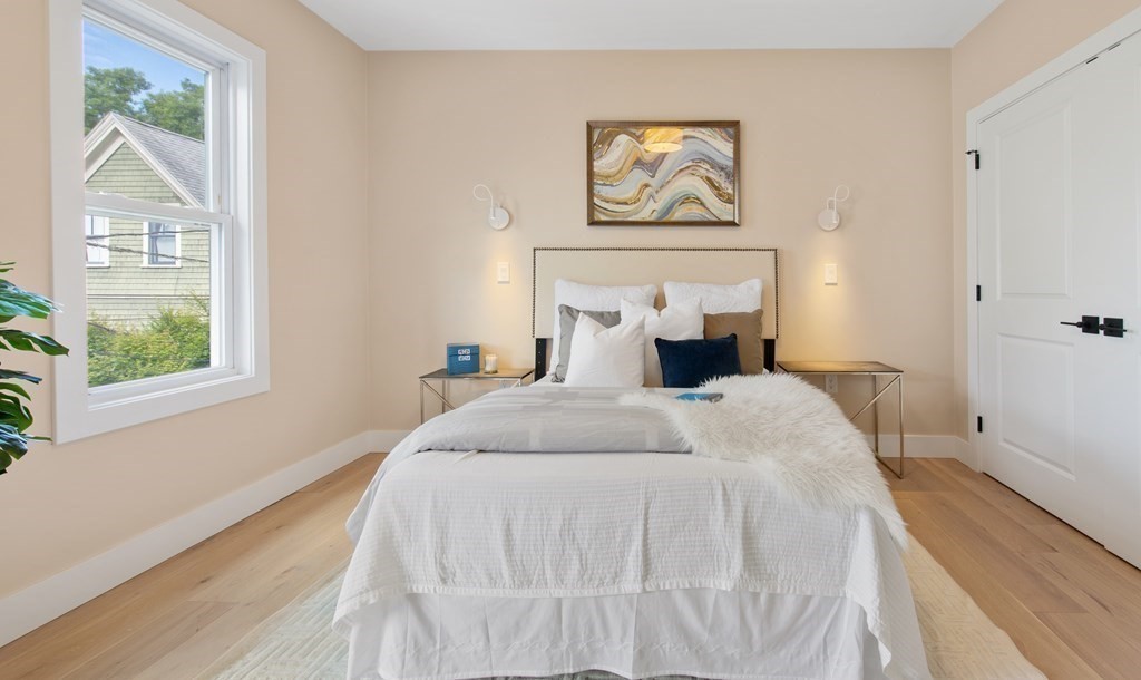 50 Whitfield Road, Unit 50 Somerville, MA 02144 - Photo 20 of 38 a bedroom with bed and a window