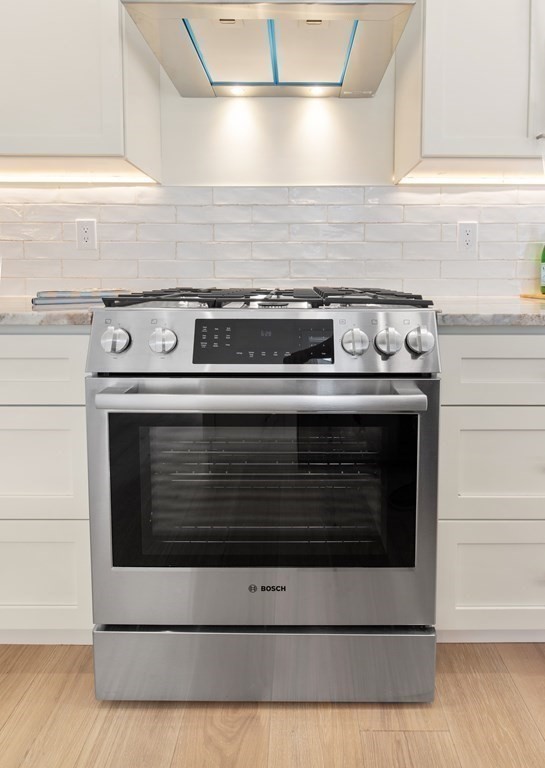 50 Whitfield Road, Unit 50 Somerville, MA 02144 - Photo 8 of 38 a stove top oven sitting inside of a kitchen