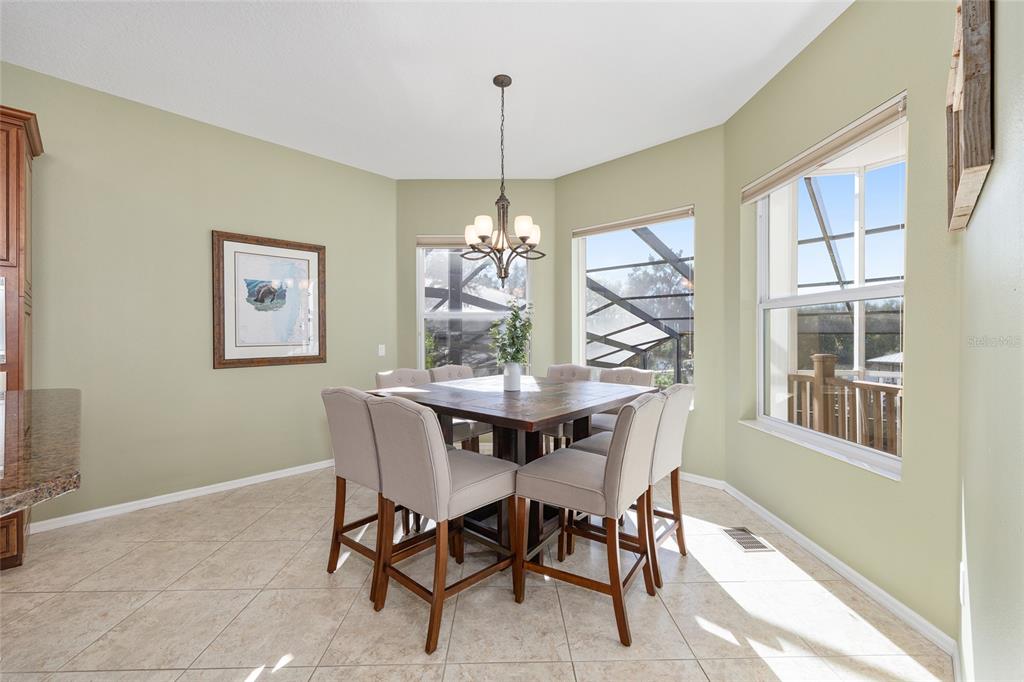 11944 West Creekside Lane Homosassa, FL 34448 - Photo 24 of 90 a dining room with furniture a chandelier and window