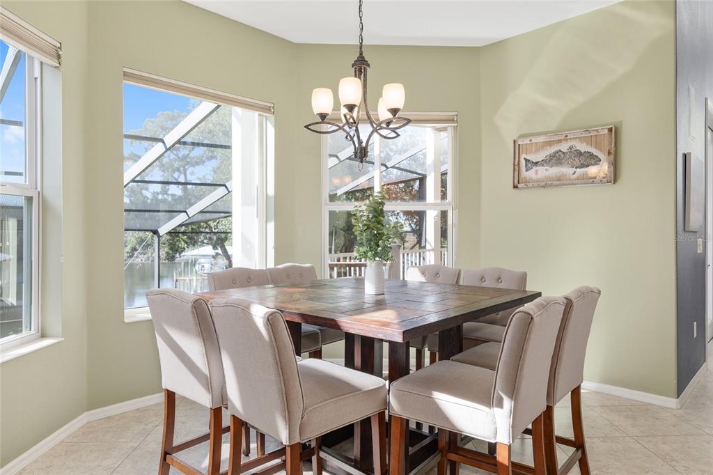 11944 West Creekside Lane Homosassa, FL 34448 - Photo 25 of 90 a view of a dining room with furniture window and outside view