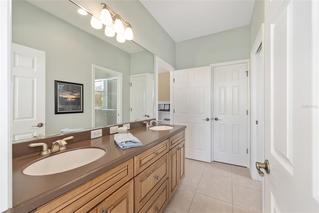 11944 West Creekside Lane Homosassa, FL 34448 - Photo 44 of 90 a bathroom with a double vanity sink mirror and double