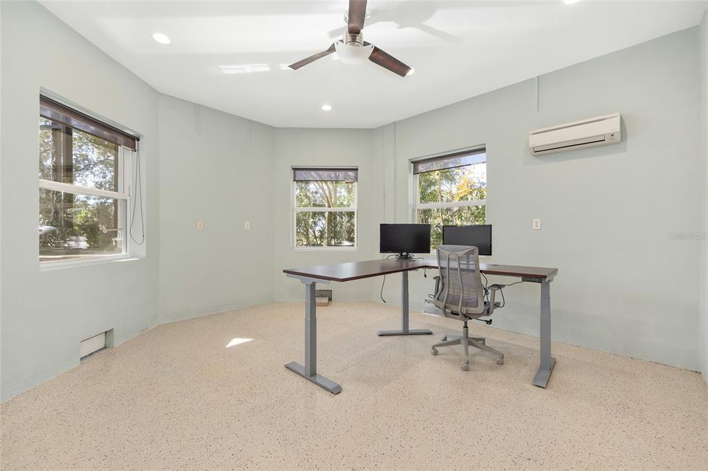 11944 West Creekside Lane Homosassa, FL 34448 - Photo 52 of 90 a view of a workspace with furniture and a window