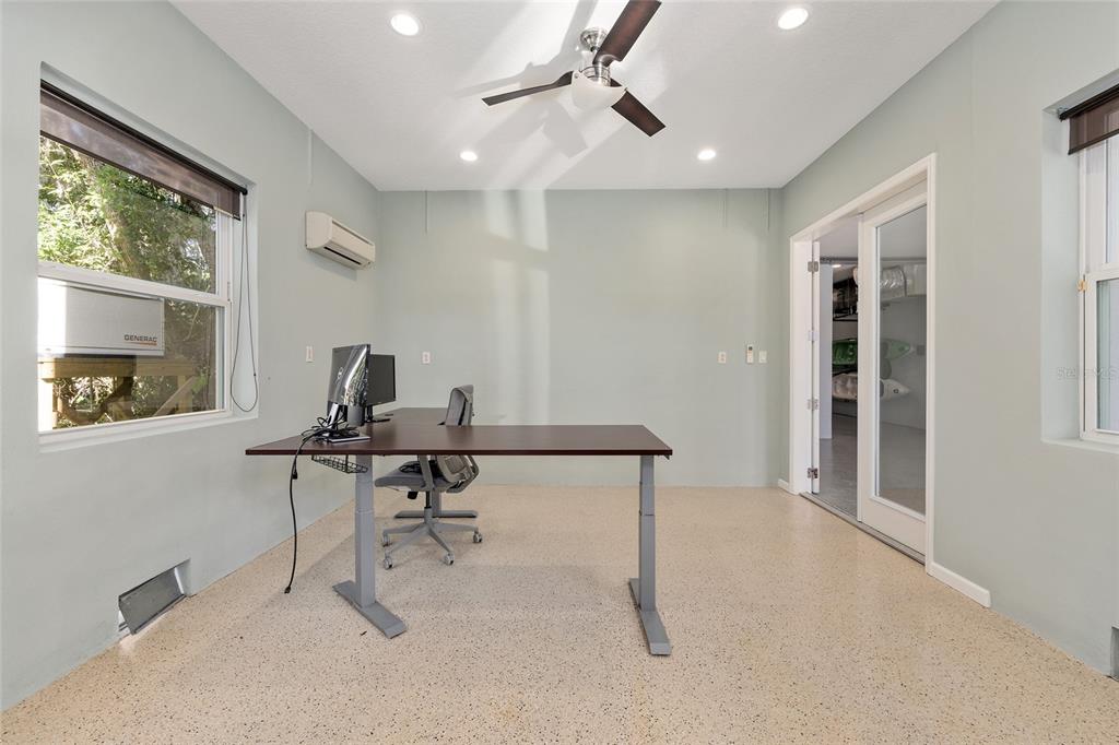 11944 West Creekside Lane Homosassa, FL 34448 - Photo 54 of 90 a view of a workspace with furniture and a window