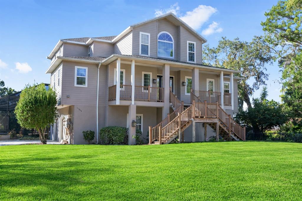 11944 West Creekside Lane Homosassa, FL 34448 - Photo 7 of 90 a front view of a house with a yard