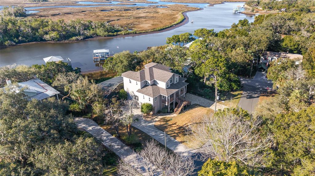 11944 West Creekside Lane Homosassa, FL 34448 - Photo 78 of 90 an aerial view of a house with a yard and lake view