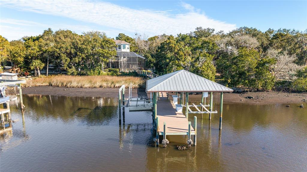 11944 West Creekside Lane Homosassa, FL 34448 - Photo 86 of 90 a view of a lake with a house