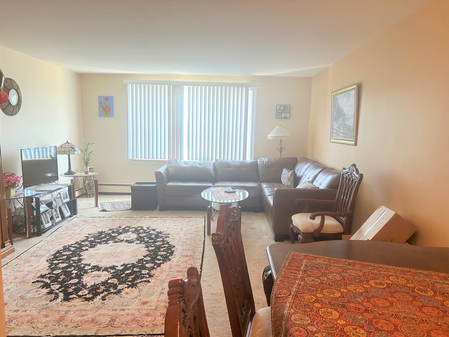 1880 Bonnie Lane, Unit 417 Hoffman Estates, IL 60169 - Photo 13 of 14 a living room with furniture rug and window