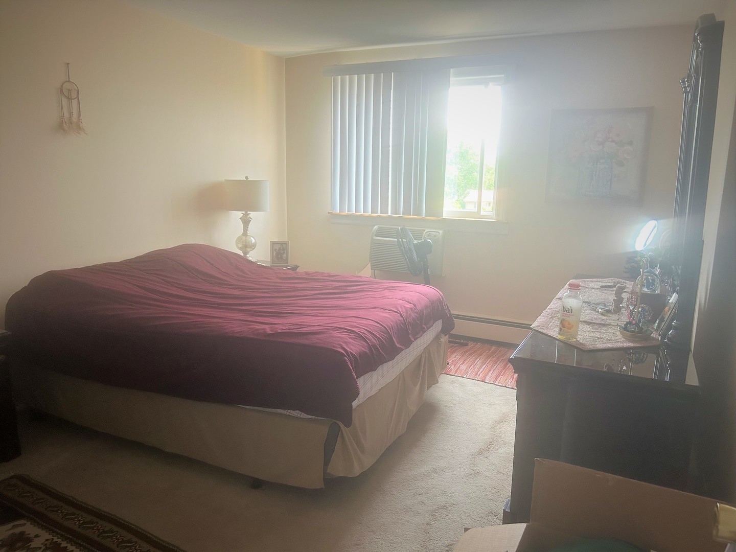 1880 Bonnie Lane, Unit 417 Hoffman Estates, IL 60169 - Photo 3 of 14 a bedroom with a bed and window