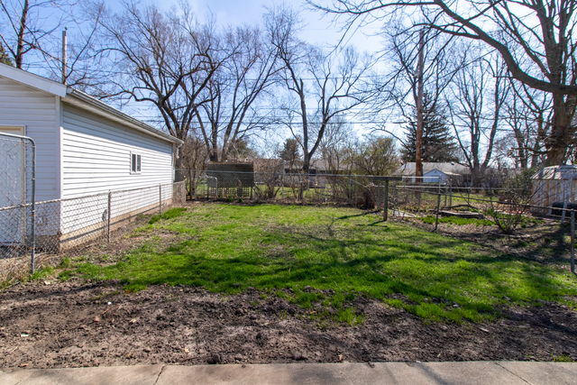 120 North Coolidge Street Normal, IL 61761 - Photo 19 of 21 a view of a backyard with a garden