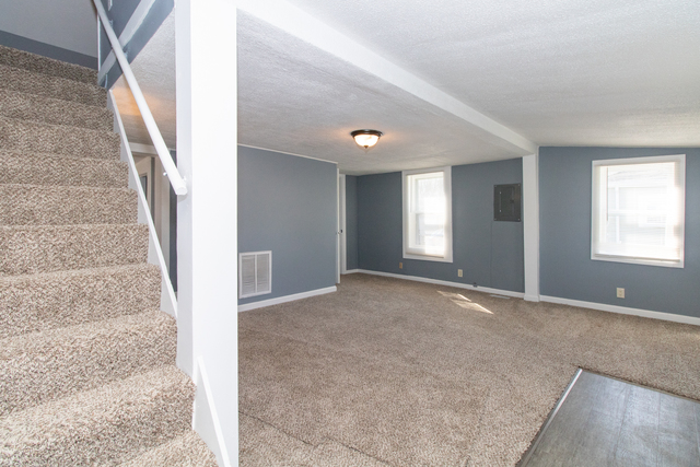 120 North Coolidge Street Normal, IL 61761 - Photo 4 of 21 a view of an empty room with stairs
