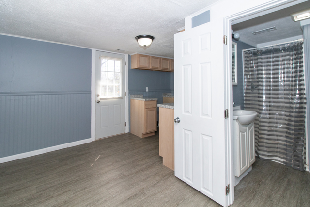 120 North Coolidge Street Normal, IL 61761 - Photo 6 of 21 a view of a hallway with wooden shelves