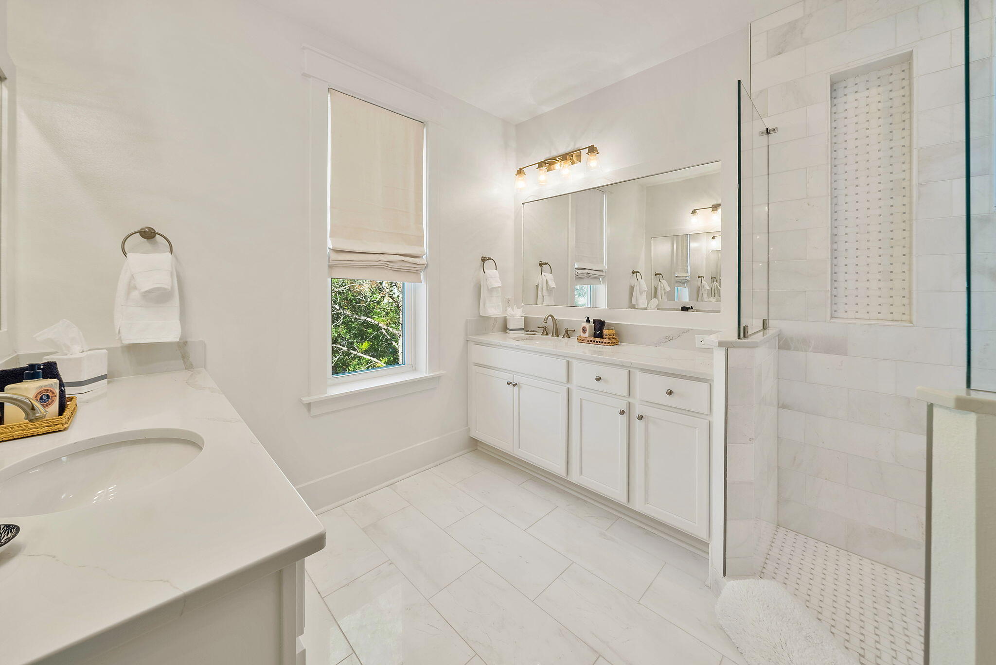 20 Beargrass Way Santa Rosa Beach, FL 32459 - Photo 31 of 50 a bathroom with a sink vanity tub and a mirror
