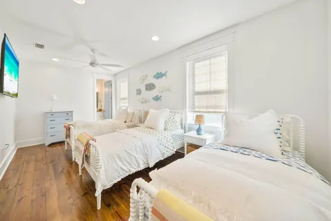 a bedroom with a bed and a painting on the wall