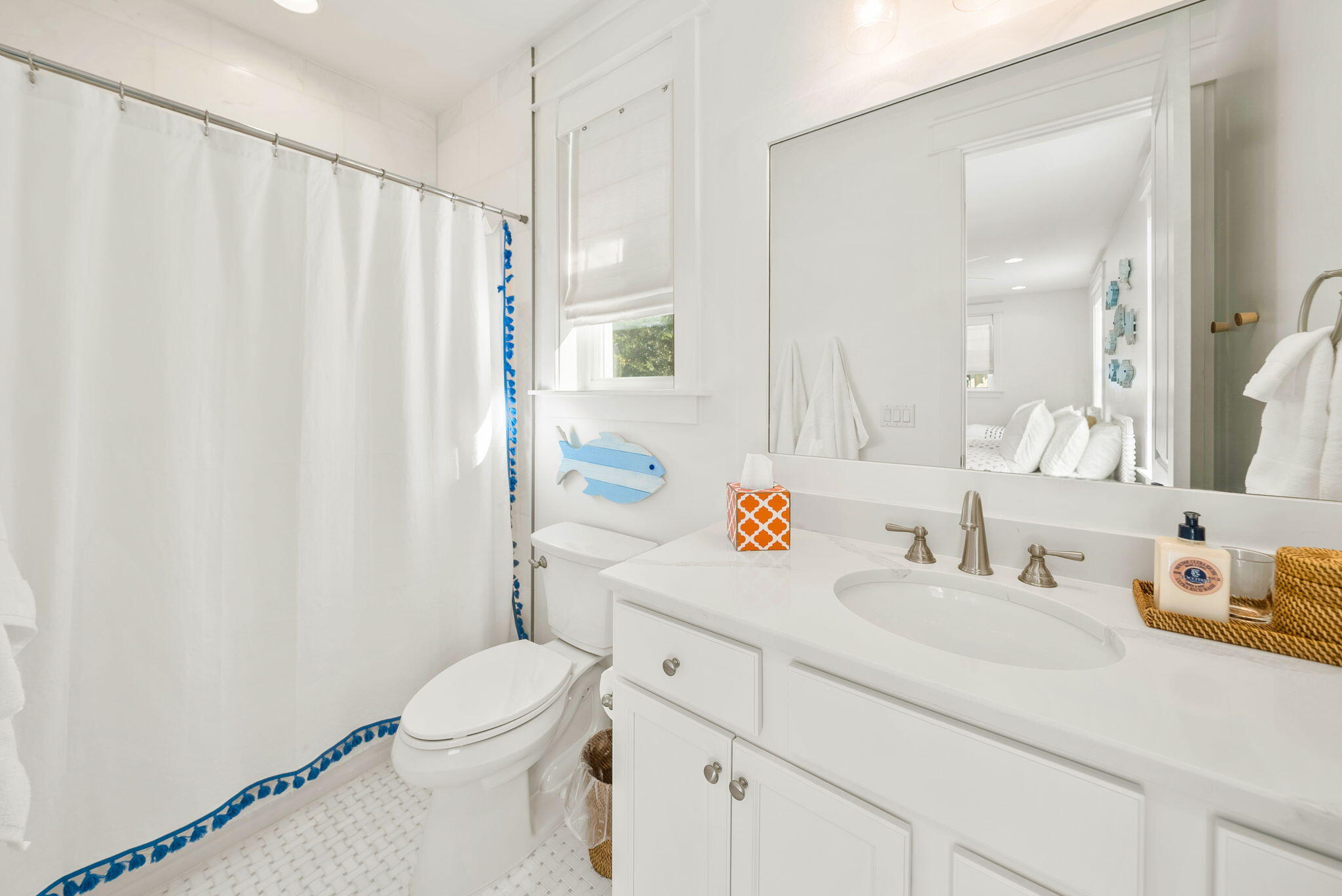 20 Beargrass Way Santa Rosa Beach, FL 32459 - Photo 37 of 50 a bathroom with a sink a toilet and shower curtain