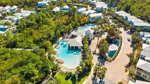 an aerial view of a house with a yard and garden