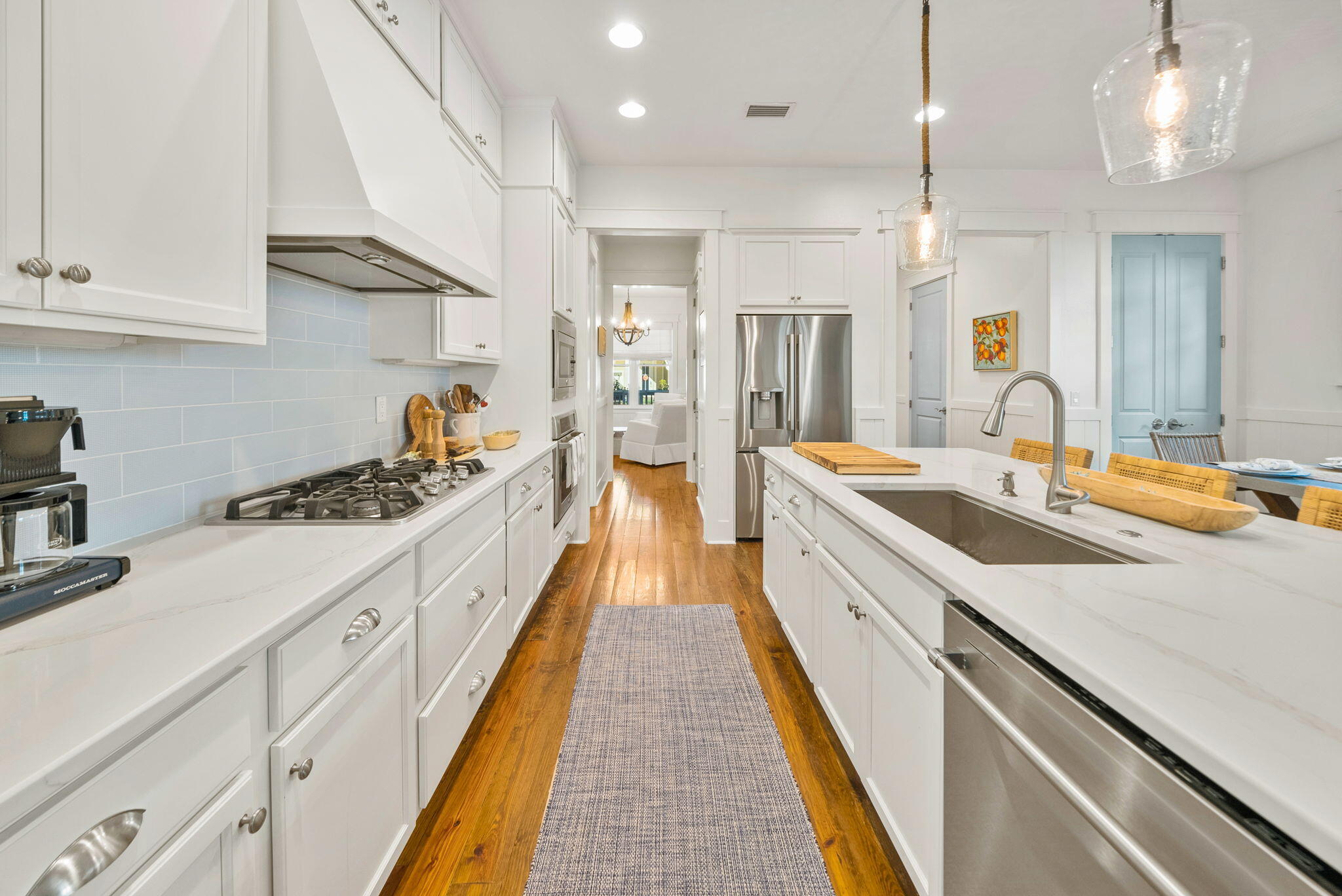 20 Beargrass Way Santa Rosa Beach, FL 32459 - Photo 9 of 50 a large kitchen with kitchen island a large counter space a sink appliances and cabinets