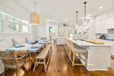 a large kitchen with a table and chairs