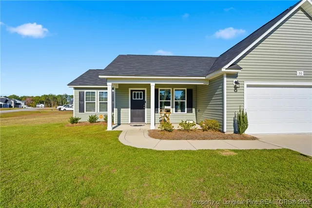 a house view with swimming pool and porch
