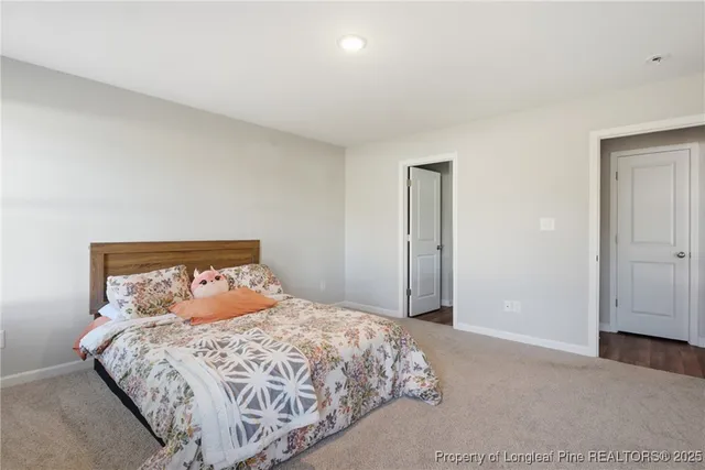 a bedroom with a bed and a mirror