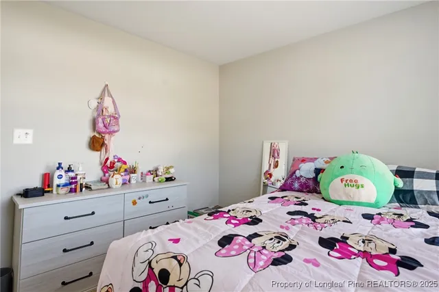 a bathroom with a granite countertop bathtub shower sink vanity and toilet