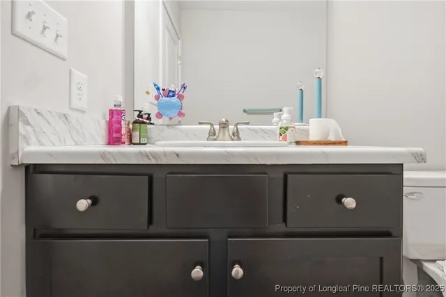 a view of a workspace with furniture and windows
