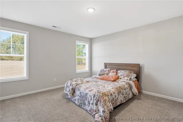 a house view with swimming pool in front of it