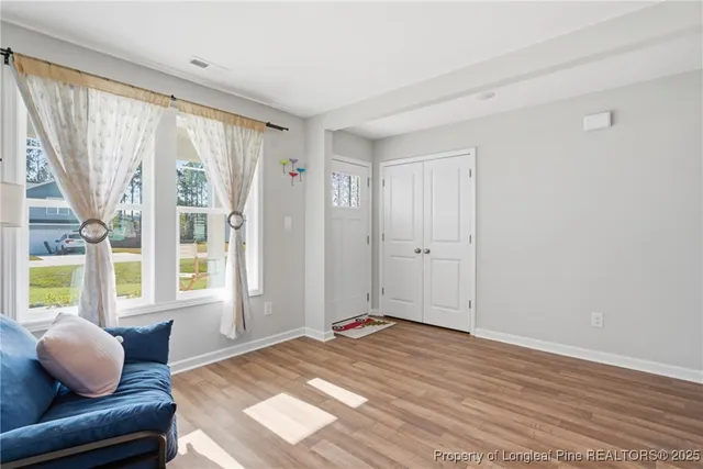 a view of livingroom with furniture and window