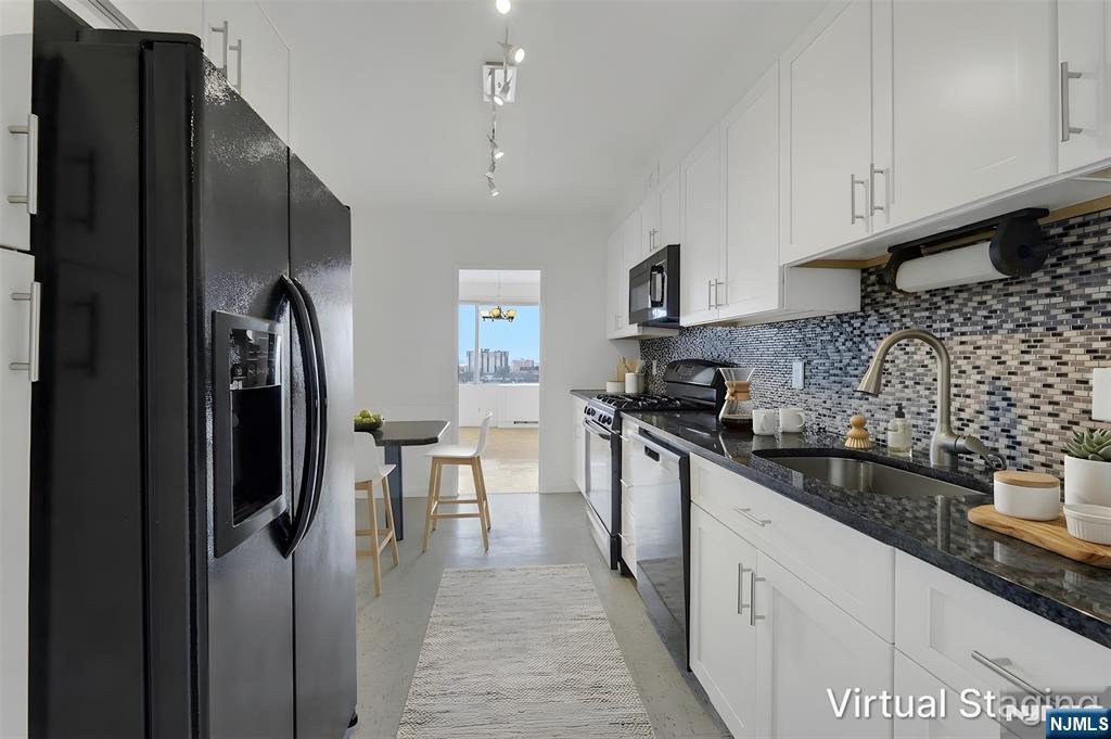 6 Horizon Road, Unit 1508 Fort Lee, NJ 07024 - Photo 7 of 46 a kitchen with stainless steel appliances granite countertop a refrigerator a sink a stove and oven