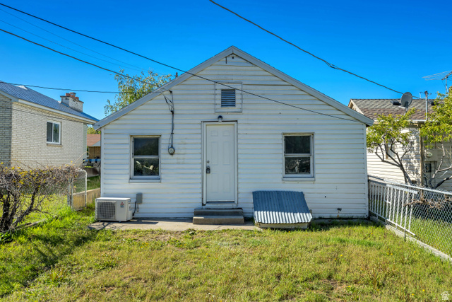 712 9th Street Ogden, UT 84404 - Photo 14 of 15 Rear exterior featuring white siding and a sloped roofline