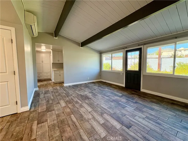 a view of an empty room and window