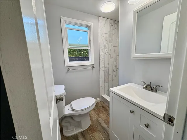 a bathroom with a sink toilet and vanity